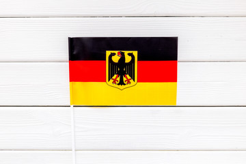 Flag of Germany on white wooden background top view