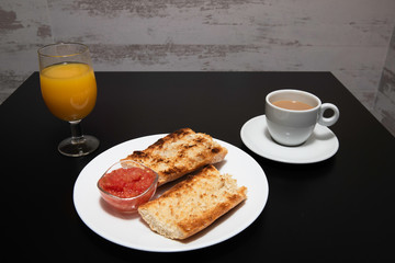 Delicious breakfast, bread, coffee and juice ready for you to enjoy