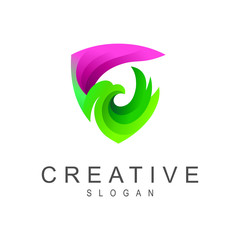 Fototapeta premium logo shield with a picture of a bird that is developing its wings, security icon