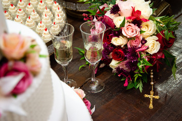 Scenic cake on a table decorated for a wedding party.