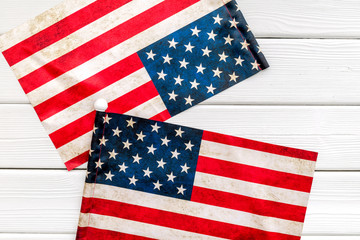 Fototapeta premium Independence day of USA with flag on white wooden background top view
