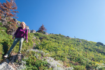 Naklejka na ściany i meble female hiker in the mountains