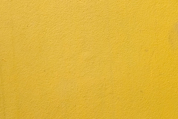 yellow cement wall background close up