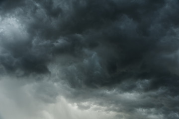 Fototapeta na wymiar Motion of dark sky and black clouds, Dramatic cumulonimbus cloud with rainy.