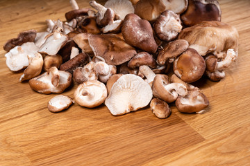 Fresh Cremini mushrooms on a wooden table