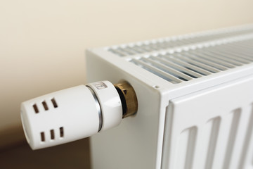 heating radiator with thermostatic knob in the living room