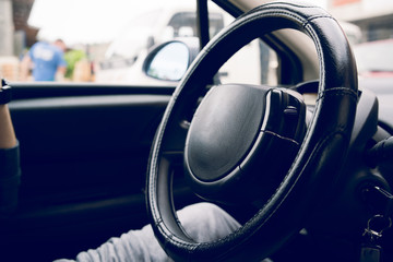 Close up on steering wheel of the car