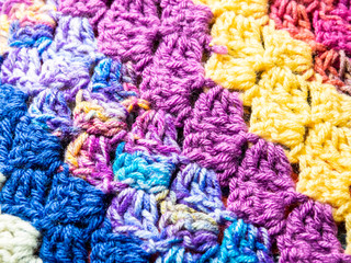Fototapeta na wymiar Crochet Stitches in a Colorful Blanket