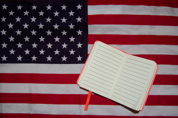 Fototapeta premium Usa flag with notebook, diary , copy space