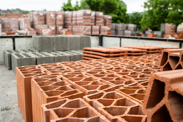 Clay tile and brick blocks concrete at the warehouse loaded in the back of the truck ready for the...