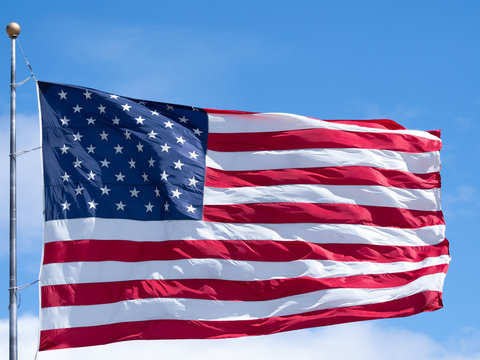 Close Up of an Unfurled American Flag on a Windy Day