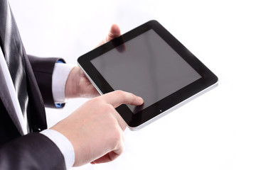 close up.businessman tapping the screen of the digital tablet