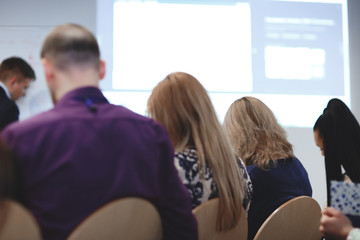 Fototapeta premium rear view.business team listening to the speaker
