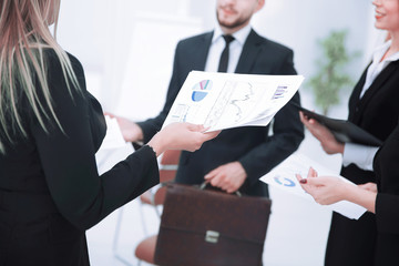 close up.businessman and team discuss financial documents