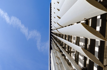 Bright Blue City Buildings With Clouds