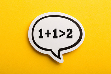 Synergy 1+1>2 Speech Bubble Isolated On Yellow Background