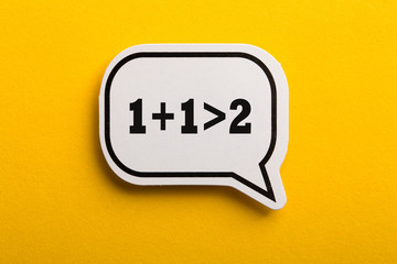 Synergy 1+1>2 Speech Bubble Isolated On Yellow Background