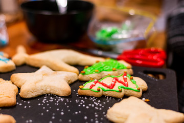 Christmas gingerbread cookies, someone decorating with icing