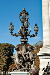 Fototapeta na wymiar Lantern on Alexander III Bridge in Paris, France