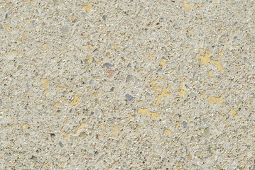 Fine exposed aggregate washed away to create a rough textured surface.