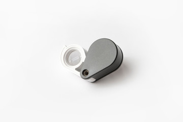 Magnifying glass for diamonds or see the amulet Isolated on a White Background.