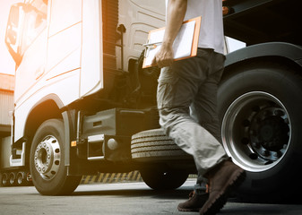 Truck Drivers is Checking the Truck's Safety Maintenance Checklist. Lorry Driver. Inspection Truck...