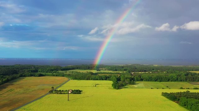 Aerial  drone panning past rainbow