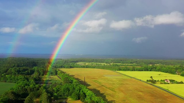Aerial drone flying by a double rainbow