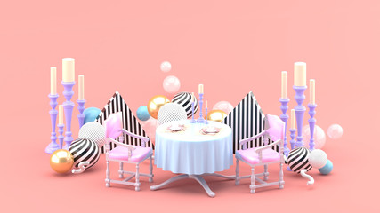 Dinner table and candle holder among colorful balls on pink background.-3d rendering.