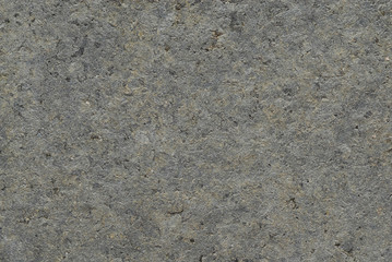 A mottled gray material with a texture.