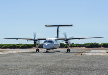 Fototapeta na wymiar A twin-engine short-haul airplane on the taxiway - Monkey Mia, WA, Australia