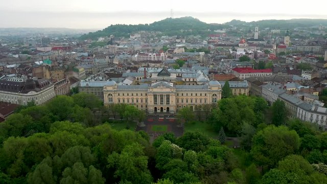 Flying near Ivan Franko National University of Lviv in rainy weather with clouds