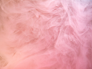 Abstract pink smoke swirling under water, close up view. Blurred background. Acrylic paint...
