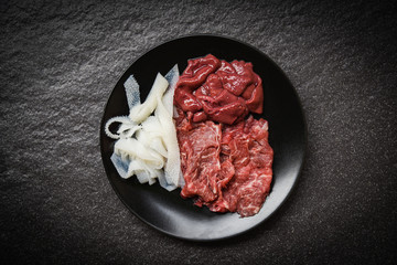 Set of meat beef slice and liver on black plate dark background for cooked or Sukiyaki Shabu shabu Japanese foods Asian cuisine - Fresh beef raw