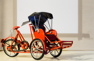 red color metal tricycle toy pedicab closeup