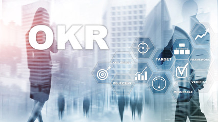 OKR - objective key result concept. Mixed media on a virtual structured screen. Project management.