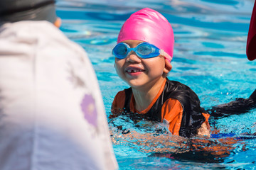 asian boy at swimming pool day time