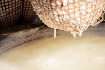Hot pan with salt in basket.