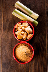 Organic Gur or Jggery Powder is unrefined sugar obtained from concentrated sugarcane juice. served in a bowl. selective focus