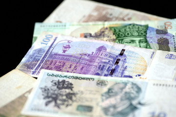 Georgian lari banknotes on a dark background close up