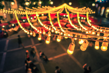 light bulb over night market festival.