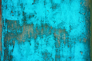 Metal surface covered with old blue paint, background