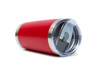 Red colour stainless steel tumbler or cold and hot storage cup isolated on white background.