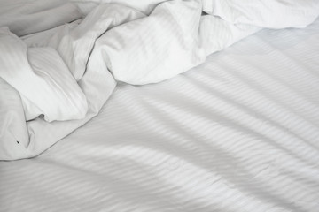 Fototapeta na wymiar White delicate soft background of fabric or bedding sheet
