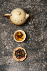 tea ceremony concept, Chinese or japanese traditions. teapot, cup of tea on dark background, several kinds of tea welding. variety of tea selection. Asia culture design concept.