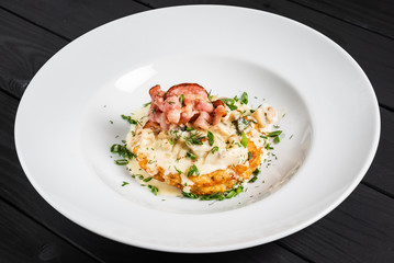 potato pancakes with bacon and sauce