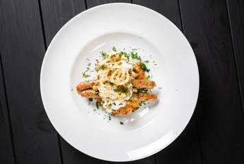 potato pancakes with sausages and fried onion