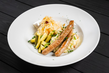 mashed potato with sausage and cabbage salad