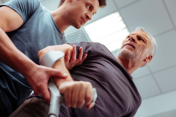 Low angle of a male nurse with his patient