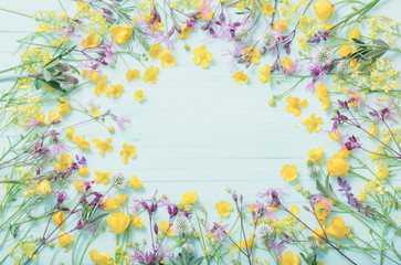 summer flowers on green wooden background